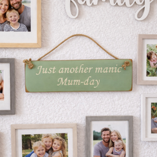 Load image into Gallery viewer, Wall with family photos and a humorous sign