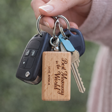Load image into Gallery viewer, Hand holding a keychain with a wooden key ring 